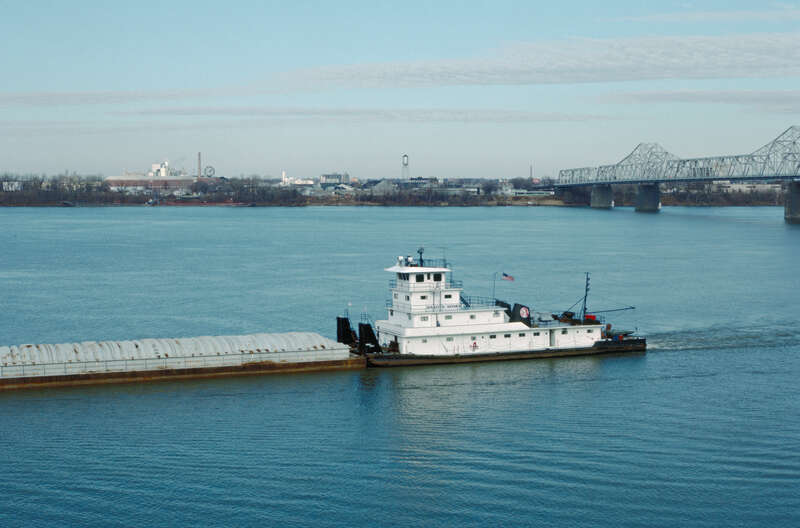 Looking NNE from Belvedere near 5th St..
Towboat "Dakota Storm" (doc. # 282986) downbound.
Clark Bridge at right.
Ohio River mile 604.
Louisville, Kentucky.
Dec. 1987.
File # 87l005.
.
This boat was built in 1960 by Marine Welding and Repair Works,