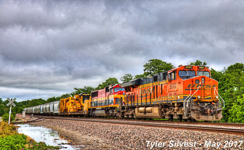 Burlington Northern Santa Fe 8082(ES44C4) and Kansas City Southern 3963(SD70MAC) Leads a Manifest Southbound on the BNSF Fort Scott Sub Parked at CP 215 Signals just before the Dennis Avenue Crossing East of Keeler Street in Olathe, Kansas.
Photo