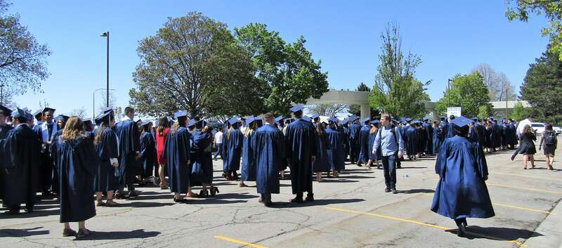 BYU graduates waiting to march to the Marriott Center for Commencement.