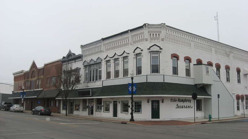 Buildings on the southwestern corner of the junction of Main (State Route 235) and Buckeye Streets in Ada, Ohio, United States.