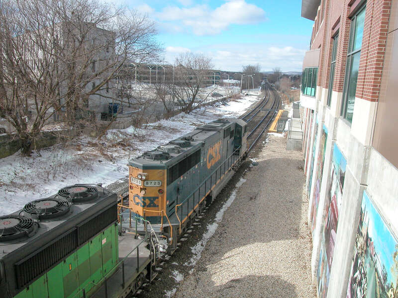 A CSX train passes Joseph Scelsi Intermodal Transportation Center in Pittsfield, Massachusetts