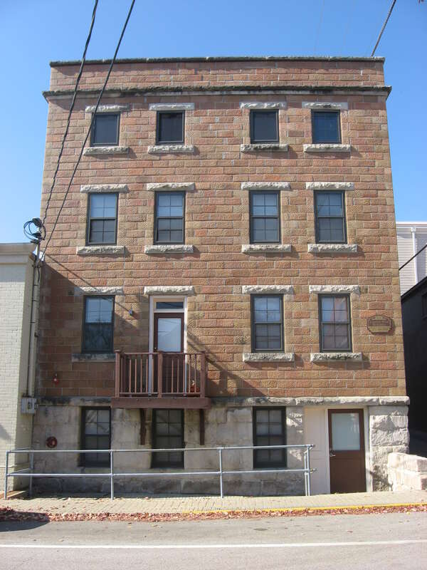 Front of the Cantol Wax Company Building, located at 211 N. Washington Street in downtown Bloomington, Indiana, United States.  Built in 1920 and since converted into apartments, it is listed on the National Register of Historic Places.