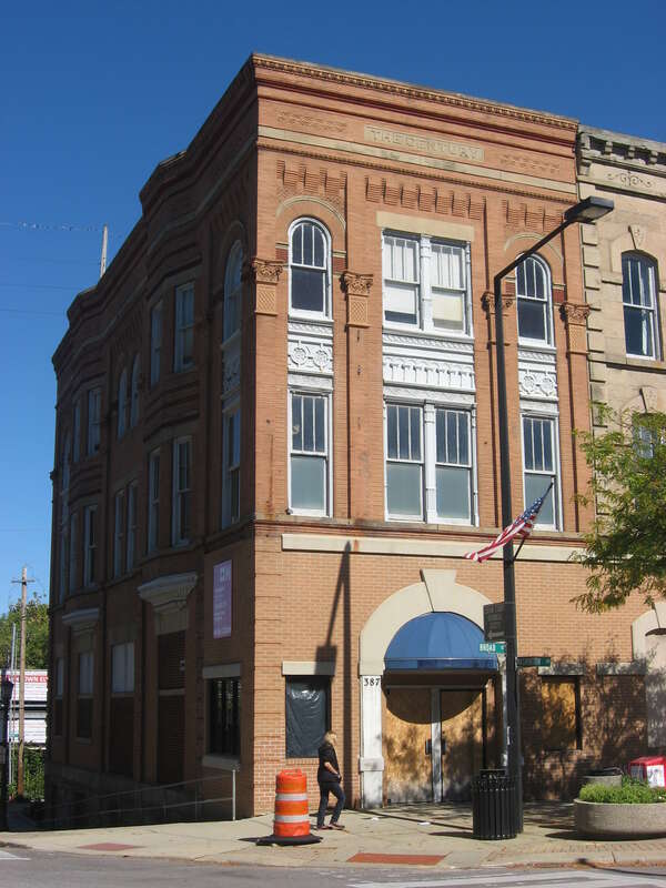 Front of the Century Block, located on the northeastern corner of the junction of Washington Avenue and Broad Street in Elyria, Ohio, United States.  Built in 1873, it is listed on the National Register of Historic Places, and it is part of a