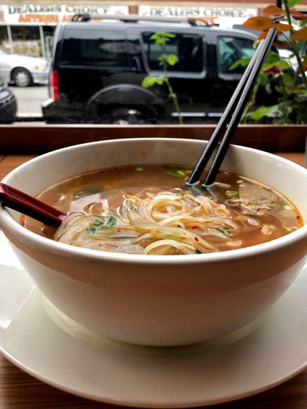 Pho served with meatballs in chicken broth with added seasoning. Nashville restaurant Love, Peace, &amp; Pho.