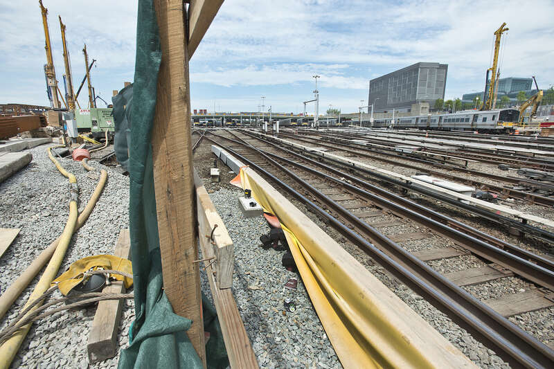Giant cranes and boring machines work in tight quarters with the Long Island Rail Road’s 24/7 operations at the LIRR west side storage yard to construct the platform that will support the office towers, apartments and shopping center of a new