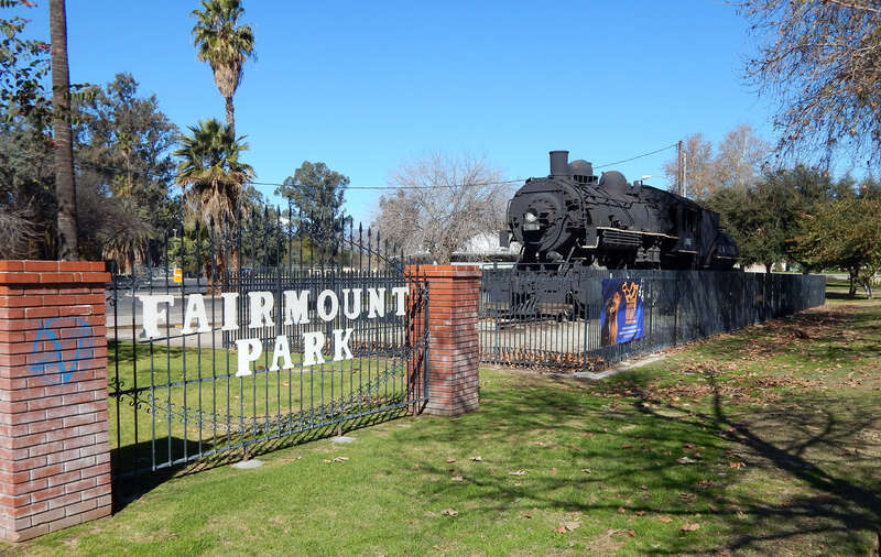 main entrance to Fairmount Park on Market Street in Riverside, California, USA, with Union Pacific Engine #6051 to the right; the locomotive was placed in the park in 1954, to commemorate the 50th anniversary of the railroad coming to the city of