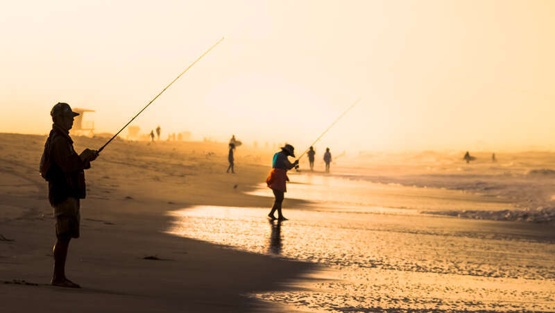 Surf fishing in the morning fog.

Huntington Beach, California