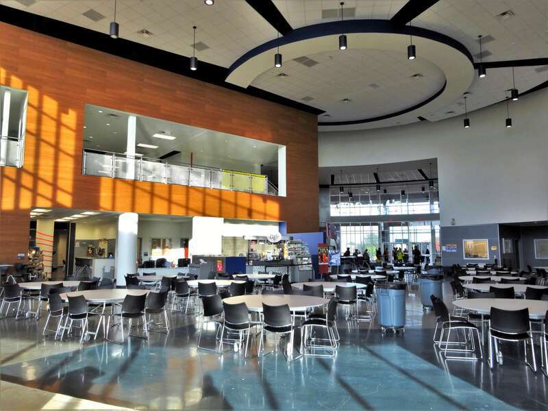 Surrounded by natural light, the "Learning Hub" at the FM9 freshman campus is an open, fluid space that combines activities traditionally associated with a library and a cafeteria. 
Flower Mound High School in Lewisville, Texas, opened its