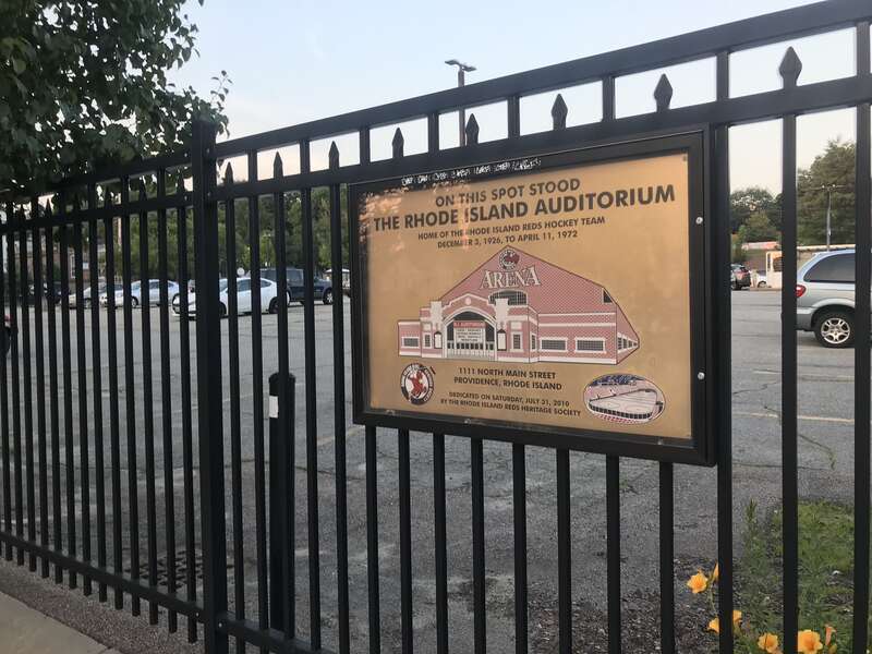 Plaque commemorating the former site of the Rhode Island Auditorium. It reads: “On this spot stood the Rhode Island Auditorium, home of the Rhode Island Reds hockey team, December 3, 1926 to April 11, 1972. 1111 North Main Street, Providence, Rhode