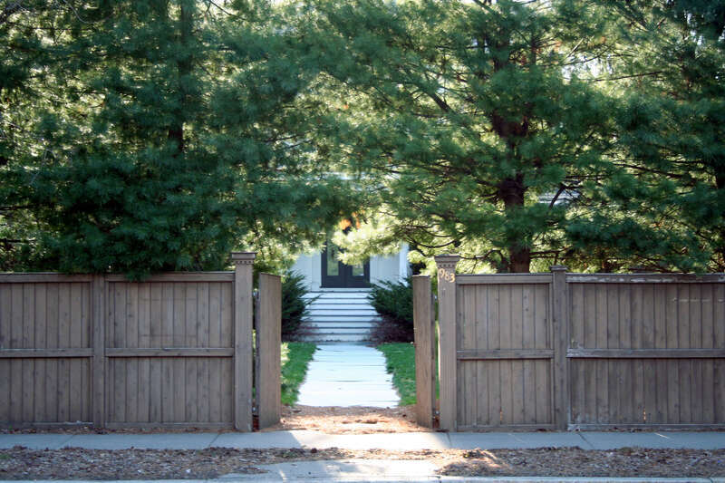 Located at 983 Centre St.

The entire house was blocked by huge pine trees.  It was obvious that someone didn't want visitors...