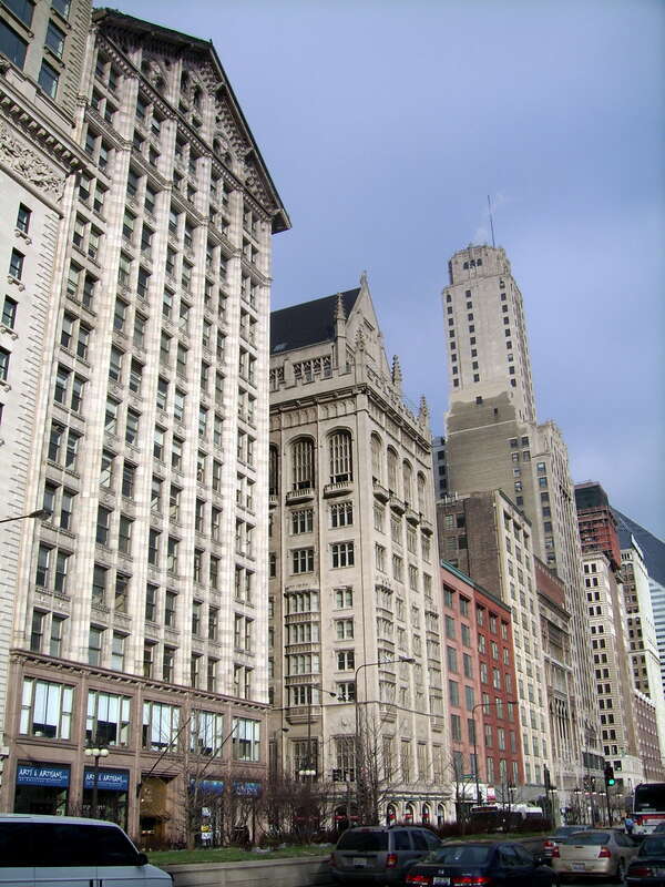 Looking North along Michigan Avenue.  The Monroe Building designed by Holabird &amp; Roche 1912, The University Club also by Holabird &amp; Roche 1908.