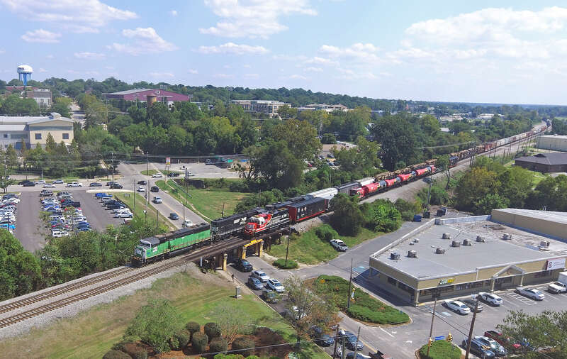 NS 975 backs past NS 191 as they head into NS Andrews Yard and NS 191 away from the yard.  Leading NS 191 is an ex BN SD60M now owned by CIT Finance.