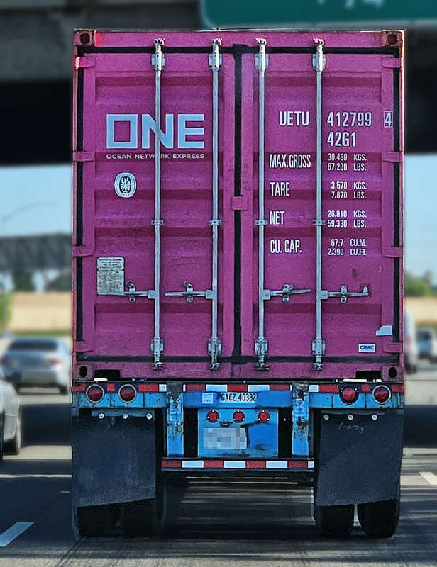 An Ocean Network Express container being transported on I-710 near Bell, California, USA.