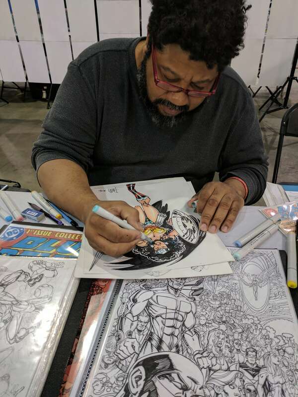Comics artist Paris Cullins colors an original sketch of Wonder Woman at Wizard World Philadelphia