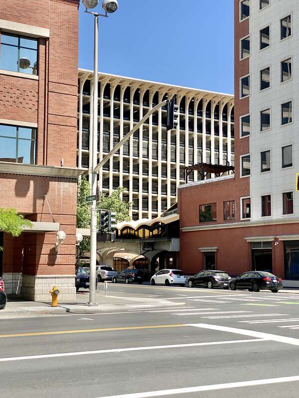 Built in 1967, this Brutalist building was designed by Warren C. Heylman to serve as a parking garage, known as Parkade Plaza.  The building features a concrete structure, exterior fins with flared brackets at the cornice, vaulted ceilings below the