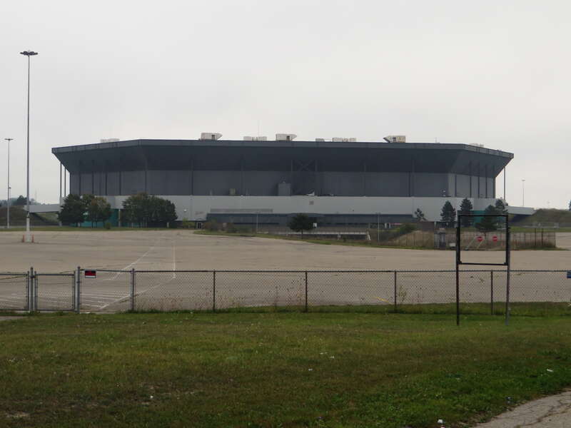 The Pontiac Silverdome, formerly known as the Silverdome, was a stadium located in Pontiac, Michigan, United States. It opened in 1975 and sits on 127 acres (51 ha) of land. When the stadium opened, it featured a fiberglass fabric roof held up by air