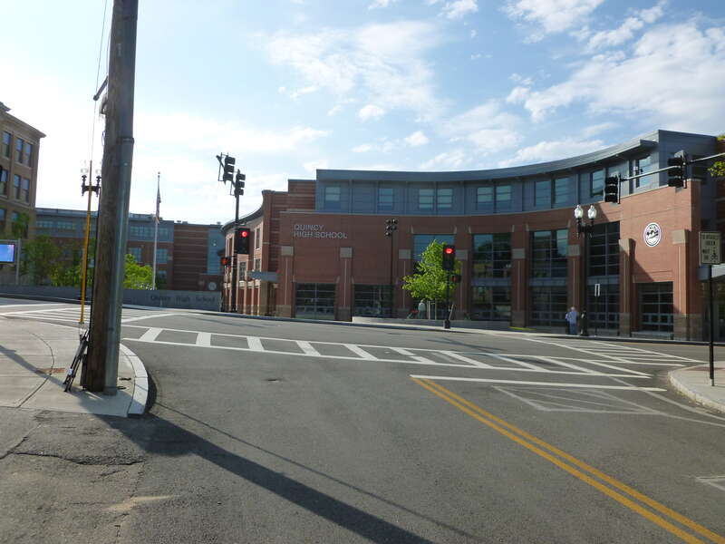 Quincy High School, located at 100 Coddington Street, Quincy, Massachusetts.  Shown is the building's main entrance as viewed from Newcomb Street.
