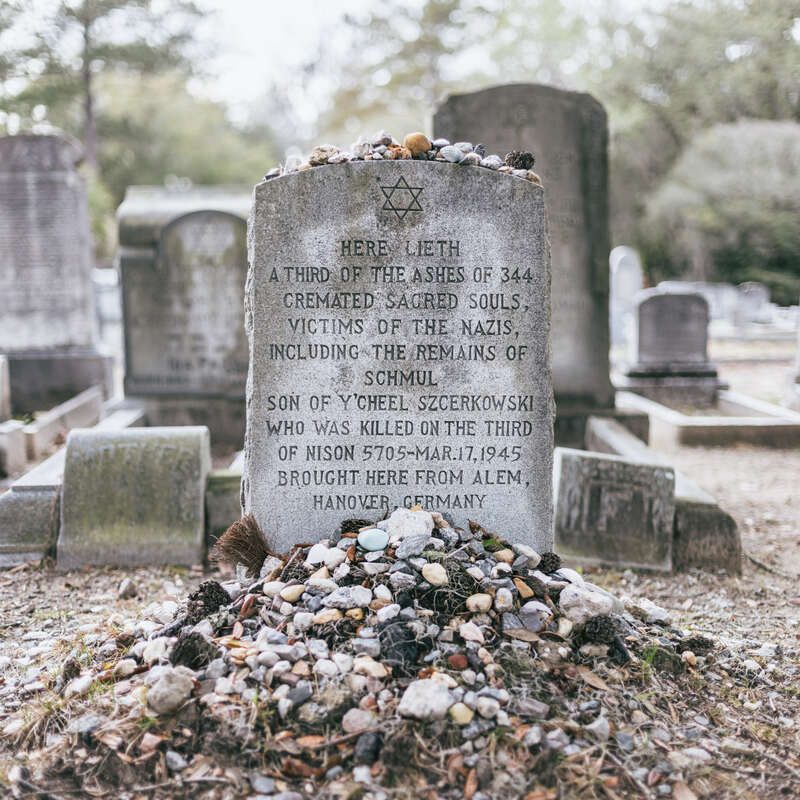 A holocaust memorial near Jewish Circle in the Bonaventure Cemetery near Savannah, Georgia. The headstone reads the following:
"Here lieth a third of the ashes of 344 cremated sacred souls, victims of the Nazis, including the remains of Schmul son of