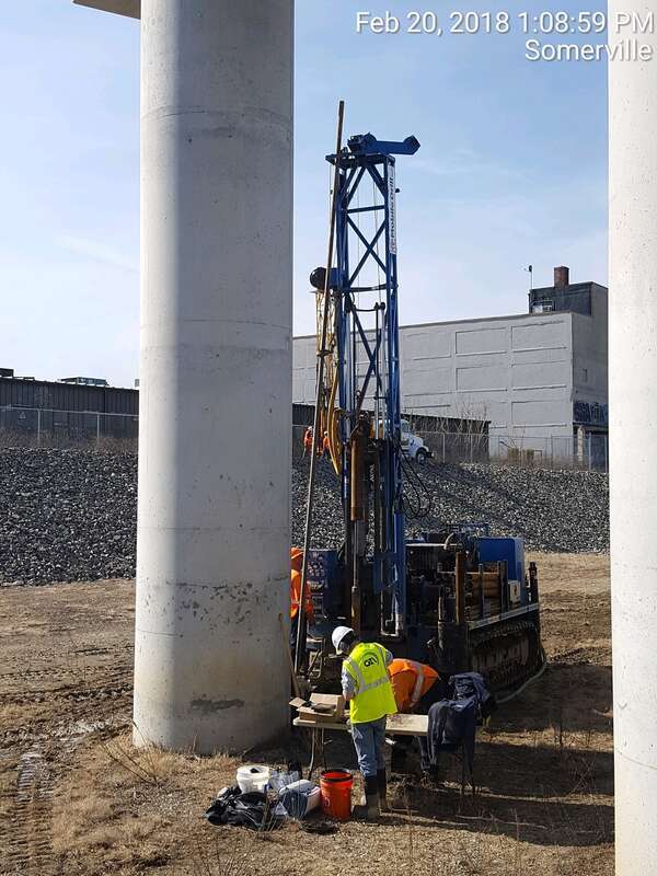 GLX Constructors field team analyzing soil sample.