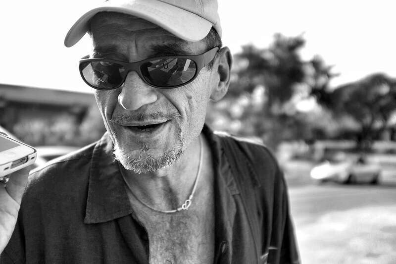 500px provided description: Phillip of Lower Greenville singing homemade songs to Jesus. He is brilliant. [#bw ,#monochrome ,#bnw ,#blackandwhite ,#homeless ,#recording ,#dallas ,#jesus ,#singing ,#streetphotography ,#blancoynegro ,#noiretblanc