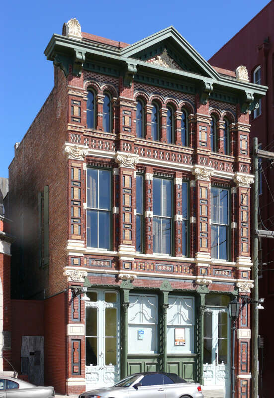 Designed in neo-renaissance, high Victorian style by Nicholas J. Clayton, noted architect, for H. M. Trueheart &amp; Co., first chartered realty firm in Texas, founded by John O. Trueheart in 1857. H. M. Trueheart joined his father in 1866, admitted