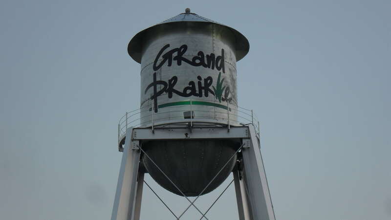 A close up of Grand Prairie's City logo on the water tower located on the corner of SW 2nd Street and W. Main at Market Square.