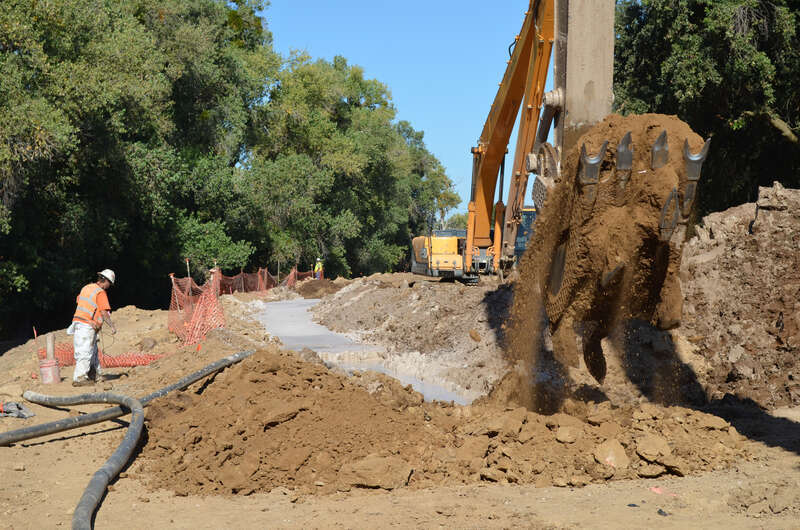 Work continues Oct. 2, 2013, on 3,300 feet of seepage cutoff wall along the north bank of the American River in north Sacramento, Calif. Completion is targeted for mid-October. Construction crews for the U.S. Army Corps of Engineers Sacramento