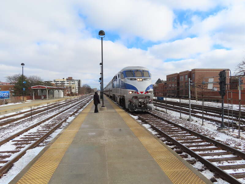 METRA No. 74 locomotive pulling into the station