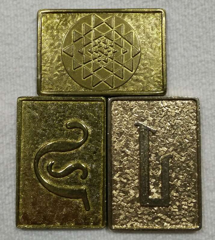 Battlestar Galactica Cubit Prop. Set of 3. Battlestar Galactica (1978 TV series). Showing stylized Initial "G" (left), stylized Initial "L" (right), Reverse side pyramid grid design (top).