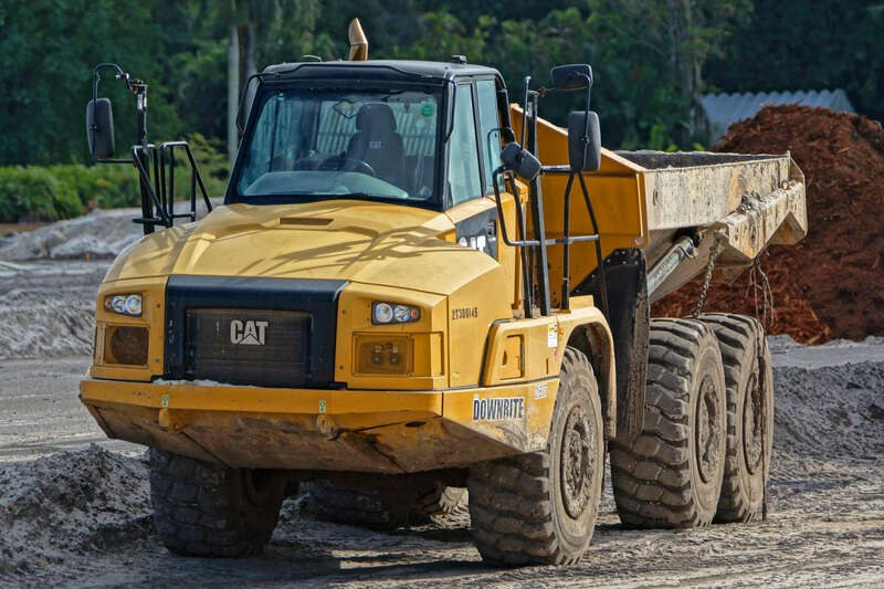 Caterpillar and John Deere Heavy Construction Equipment in a Davie Field under a cloudy sky. A drive-by opportunity I turned around for. Part of my New Years' Resolution not to take it for granted that tomorrow will be another day to stop and capture