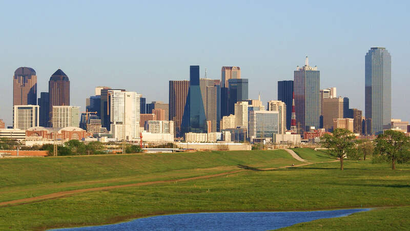 Downtown Dallas in the background with the Trinity River in the foreground. Taken from the N Hampton Rd bridge.