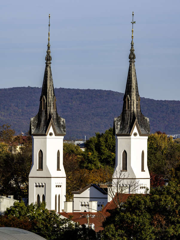 The spires of Evangelical Lutheran Church, with Catoctin Mountain behind, Frederick, Maryland, USA