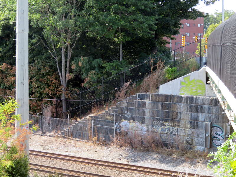 The former site of Revere station seen in August 2018. There appear to be steps on the bridge abutment that were formerly used to reach the platform.