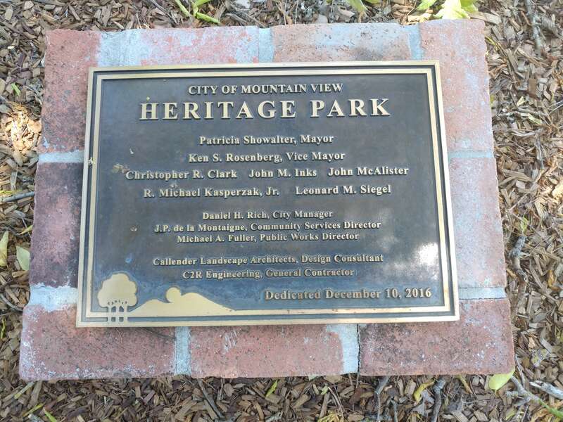 A historical plaque marking the dedication date of Heritage Park as "December 10, 2016".