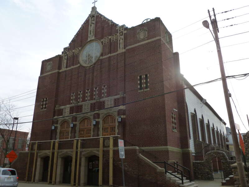 The east and north sides of Holy Rosary Church.  Located on the corner of Essex Street and Union Street in Lawrence, Massachusetts.
