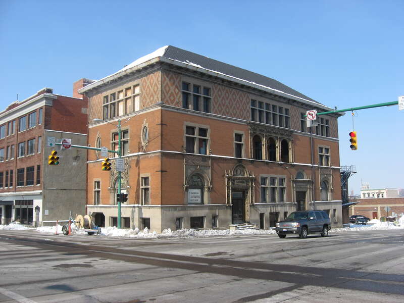 Front and southern side of the former Lagonda Club Building, located on the northwestern corner of the intersection of Spring (State Route 72) and High Streets in downtown Springfield, Ohio, United States.  After the club ceased to use the building,