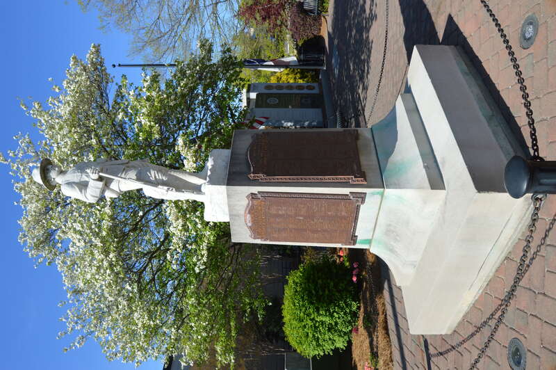 Southwestern-angle view of the High Point First World War memorial, located at the Main Street overpass over the rail line in downtown High Point, North Carolina, United States.  No date is present, but the plaques' references to "The World War"