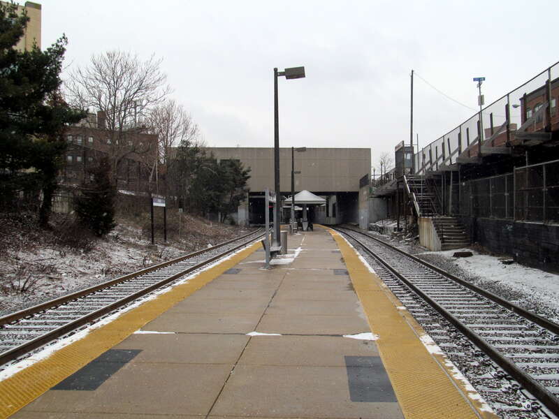 Commuter rail platform and station building at Porter on a snowy day