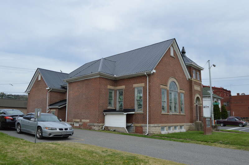 Western side and front of St. James AME Church, located at 329 Twelfth Street (U.S. Route 60) in Ashland, Kentucky, United States.  Built in 1912, it is listed on the National Register of Historic Places.