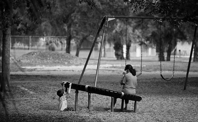 
500px provided description: guardian and child on playground [#guardian child playground]