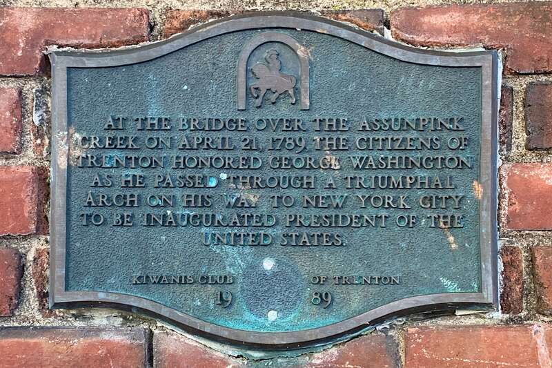 Historic information at the site of the Triumphal Arch for George Washington's reception at Trenton on the bridge over the Assunpink Creek in Trenton, New Jersey.