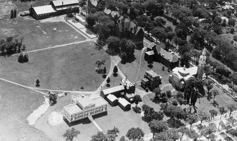 Aerial of the back of University Row at the University of Vermont, 1931.  Ira Allen Chapel (far right), Fleming Museum (lower left), Billings Library, Williams Hall, &amp; Old Mill (upper center).