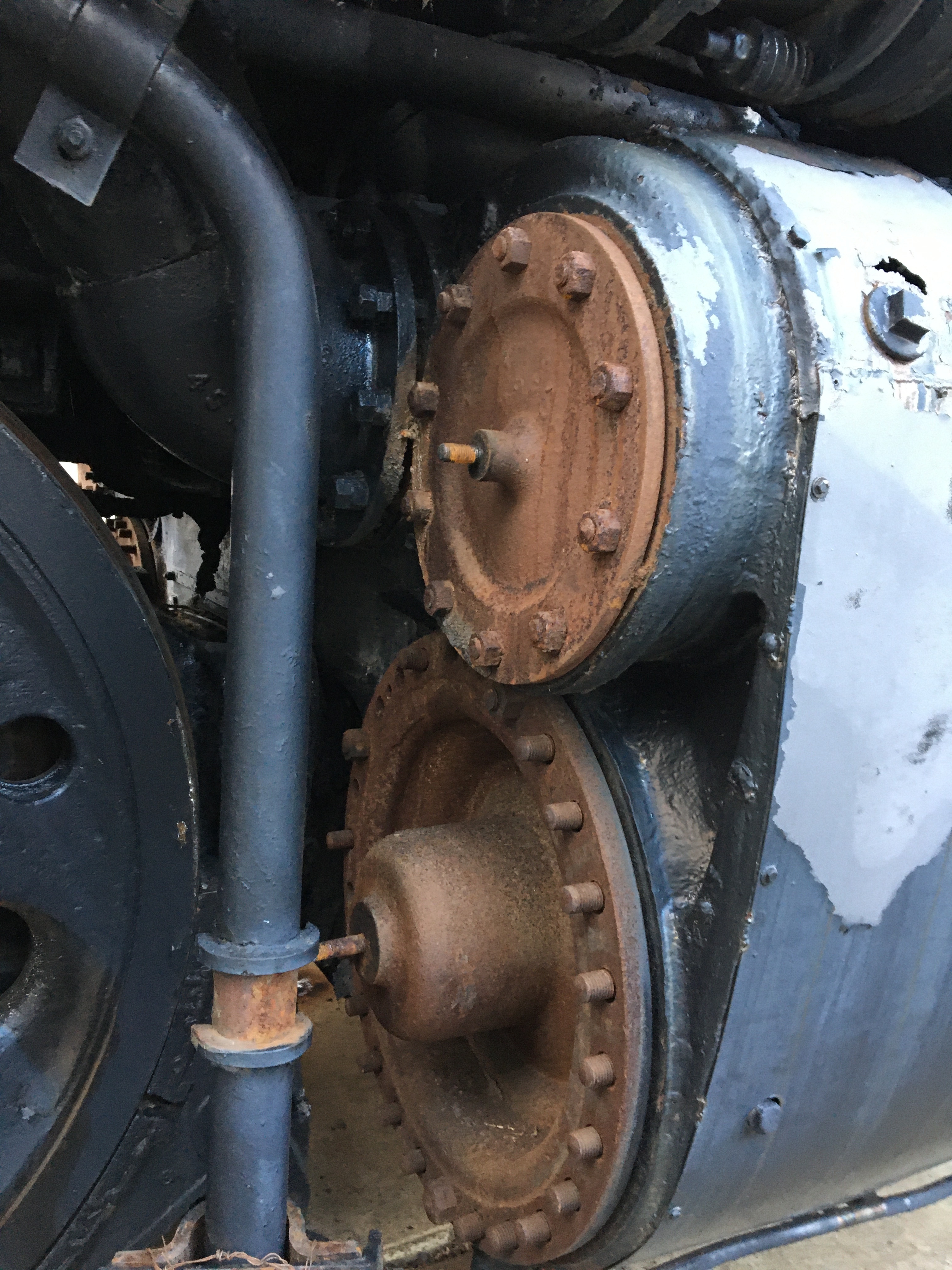 Close up view of rusted cylinder heads near the train's wheels.
"Big Boy's" cylinder heads on one of its steam chests.
Keywords: locomotive; uprr big boy 4012; restoration; uprr; steamtown; 4012; steamtown NHS; big boy 4012; train
