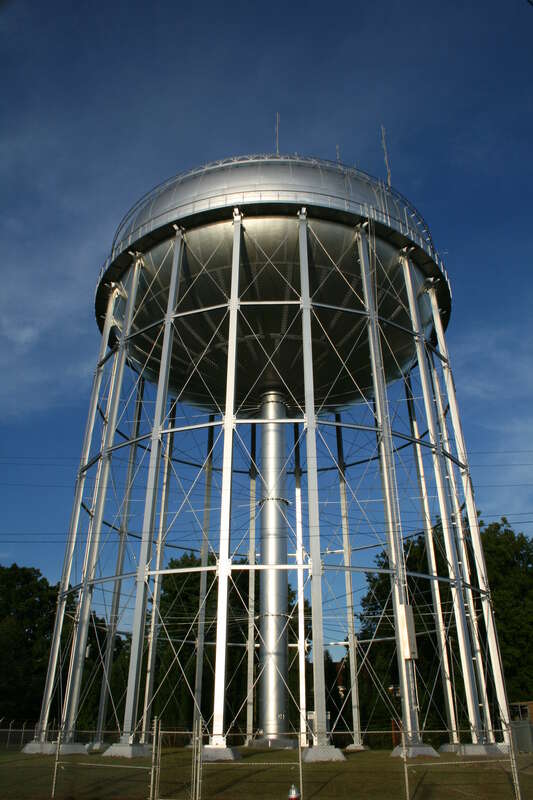 A water tower, viewed from the railroad, in Burlington, North Carolina.