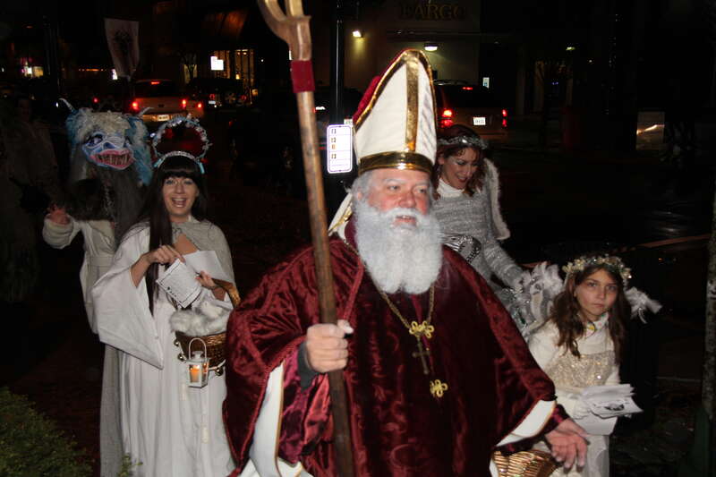 St Nicholas leading the parade, warning children to behave and beware of the Krampusnacht.
