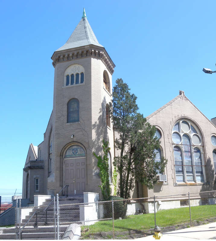 Looking east along Clinton Avenue and across Hedden Terrace at church on a sunny midday.