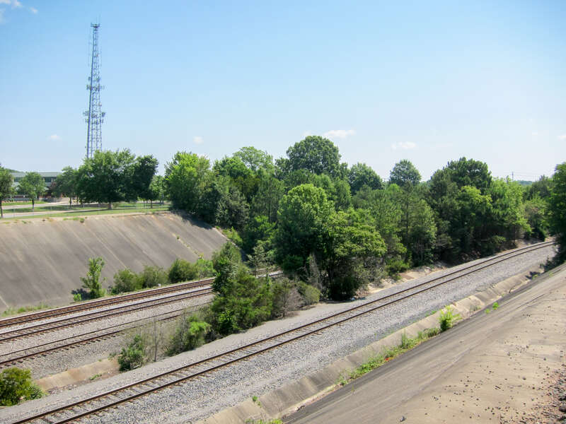 Concrete-lined ravine where the Norfolk Southern tracks operate through downtown Gastonia, North Carolina; taken from behind the Bradley Station.