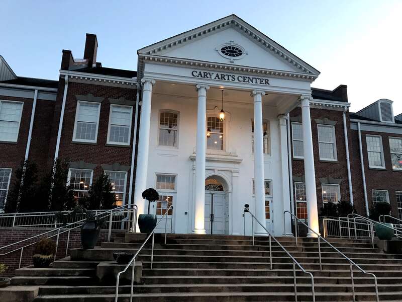 The front face of the Cary Arts Center in Cary, North Carolina on February 27, 2021. The location was originally the Cary High School and later became the Cary Public High School and Farm Life School in 1914. After the high school moved in 1961 it