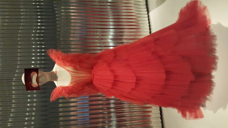 "Dior Red" tulle ball gown in tiered tulle fans by Maria Grazia Chiuri for Christian Dior (Spring-Summer 2018) on display at the Denver Art Museum