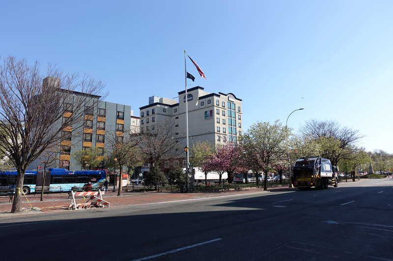 Looking at the Alfred J. Kennedy Memorial Flagstaff within the Daniel Carter Beard Mall section of Flushing Greens, in the median of Northern Boulevard at Main Street in Downtown Flushing, Queens. The "Greens", a promenade in the median of Northern